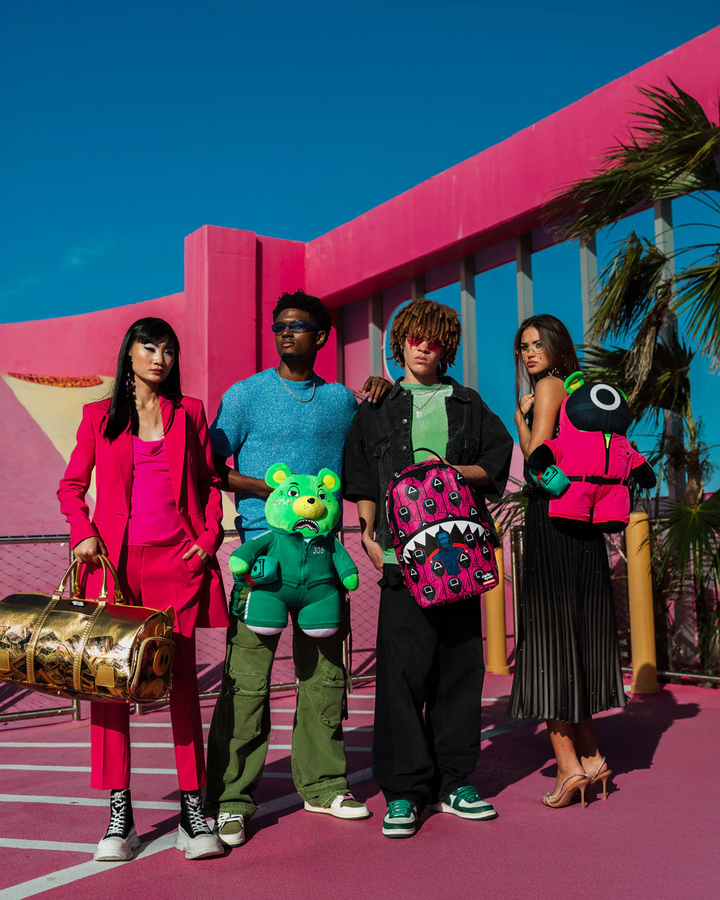 Sprayground X Squid Game Lined Up Front Man & Pink Guard Shark DLXSV Backpack
