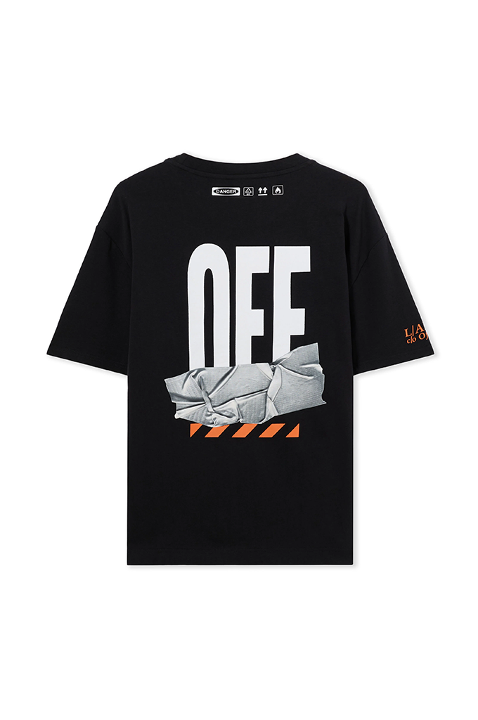 A black short-sleeve graphic t-shirt featuring a large white 'OFF' text print on the front, layered over a gray crumpled paper graphic with orange hazard stripes. The brand Off-White is visible on the inner neck label and sleeve.#color_black
