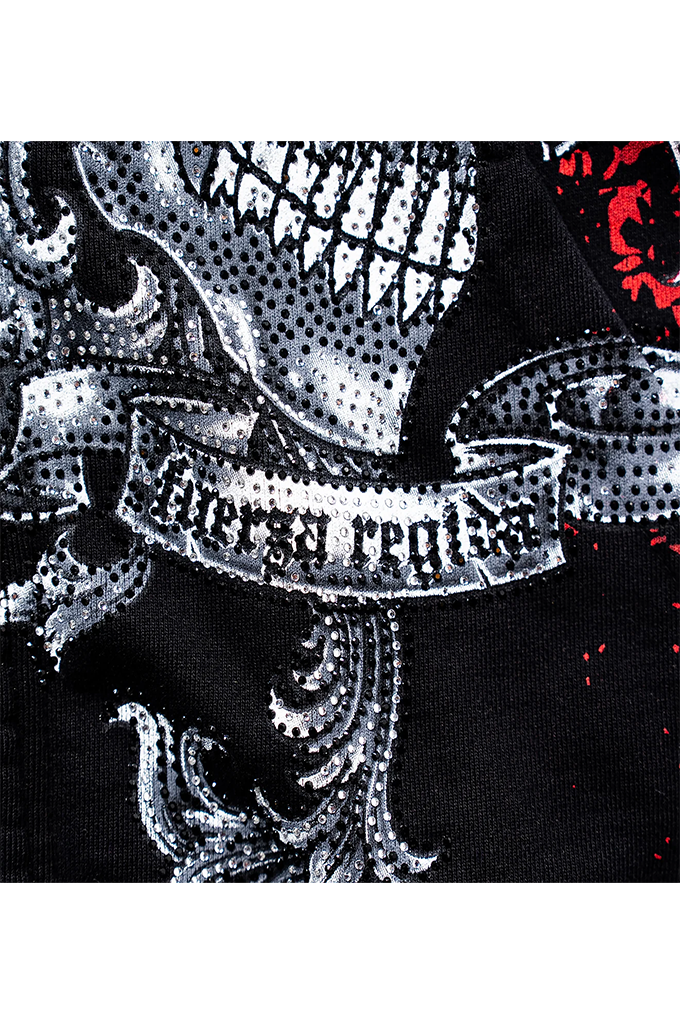 Close-up of a black garment featuring a large silver and white skull graphic with a banner reading 'forever alone' and a small red graphic in the upper right.