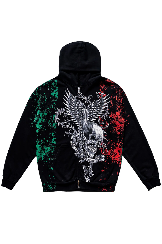 A black zip-up hoodie featuring a large graphic print on the back. The design displays a silver metallic eagle and skull motif in the center, flanked by green paint splatter on the left shoulder and red paint splatter on the right shoulder, mimicking the Mexican flag.