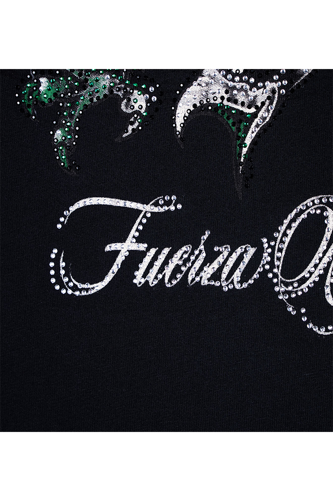 Close-up of a black garment featuring a large silver rhinestone script reading 'Fuerza' and decorative silver and green embellishments near the top.