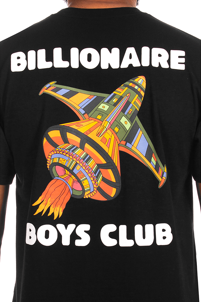 A close-up of the back of a black t-shirt featuring a colorful retro rocket graphic and the white text 'BILLIONAIRE BOYS CLUB'.