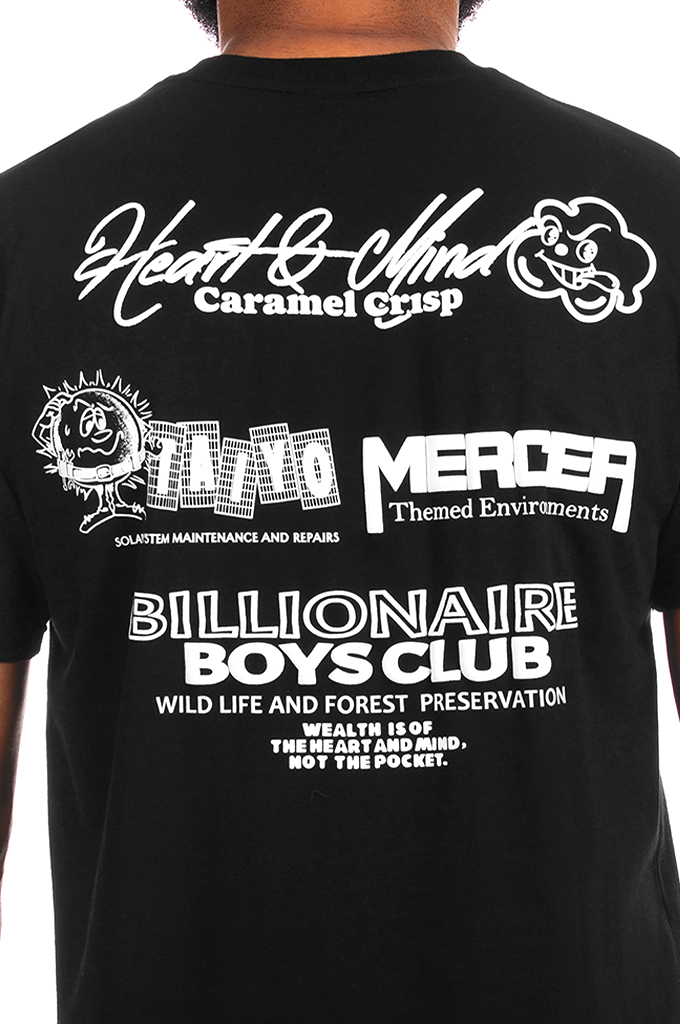 A close-up of the back of a black t-shirt featuring white graphic prints and text, including 'Heart & Mind Caramel Crisp' and 'Billionaire Boys Club'.