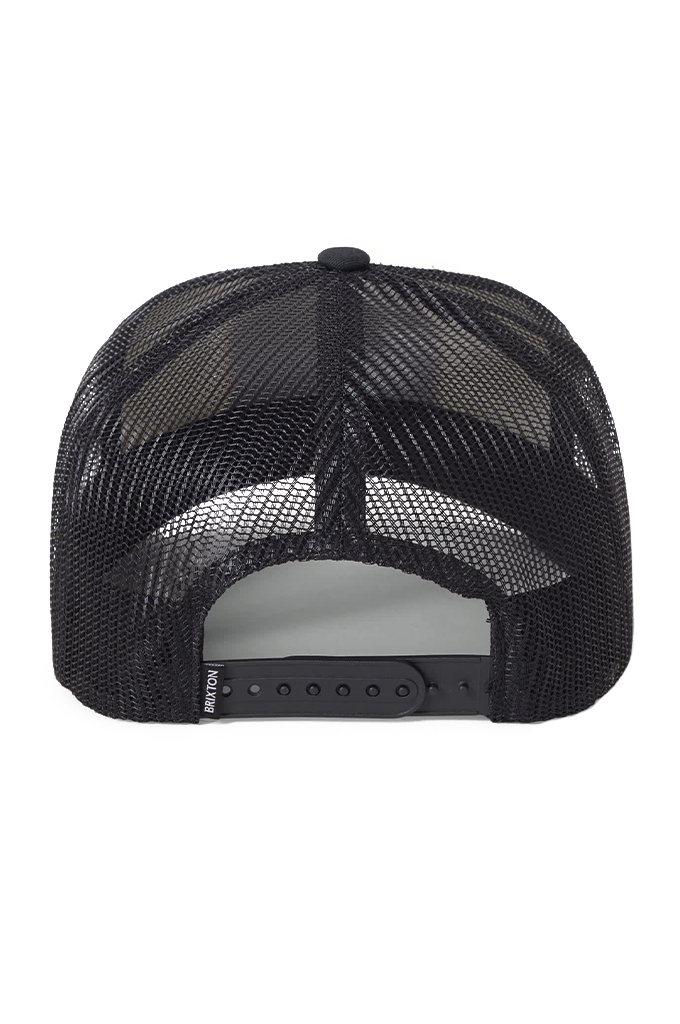 Rear view of a black mesh snapback trucker hat, showing the adjustable plastic strap with a small Brixton brand tag on the left.