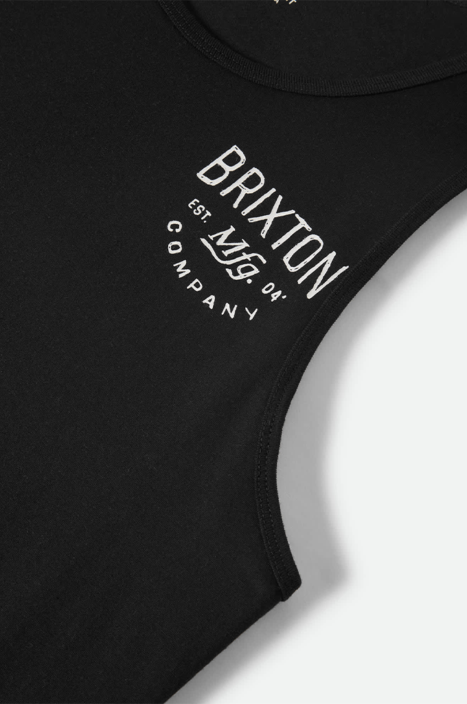 Close-up view of a black Brixton tank top. The chest features a distressed white graphic reading "BRIXTON COMPANY" curved around "EST. Mfg. 04".
