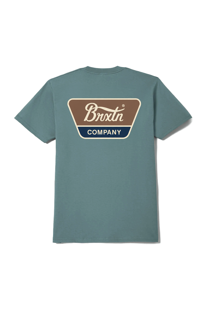 A teal blue short-sleeve t-shirt shown from the back, featuring a large retro-style graphic on the upper back with the text 'Brixtn COMPANY' in white, brown, and navy blue. #color_ocean-breeze-brown-dark-navy