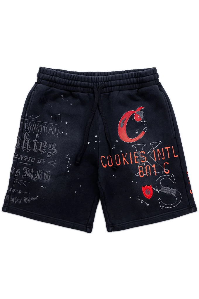 Black sweat shorts with red and gray graphic prints, featuring 'Cookies Intl 801 C' and a red 'C' logo on the left leg, and distressed text on the right leg.