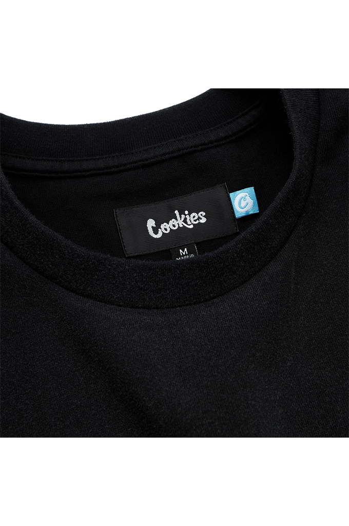 Close up of a black Cookies tee shirt round neckline with the woven label shown reading Cookies on a white background. 