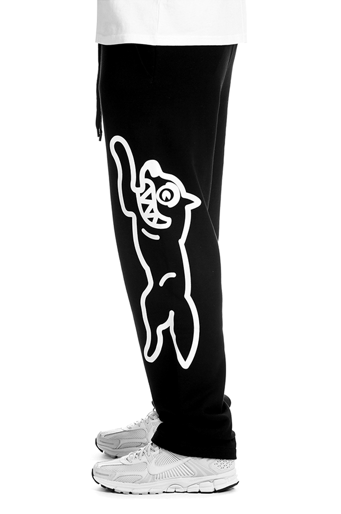 ICECREAM Mens Mint Drawstring Sweatpants in black (Style 461-6105) featuring a relaxed cotton fit and oversized white Running Dog graphics printed on the side legs.