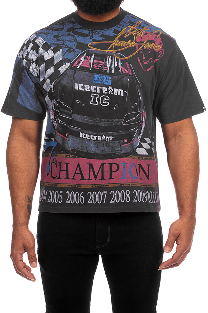 Oversized black graphic t-shirt by ICECREAM featuring a detailed racing car graphic on the front with "ICECREAM IC" branding, checkered flags, and "CHAMPION" printed above the years 2004 to 2010.