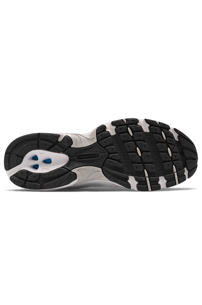 A top-down view of a Nike sneaker's outsole, showing a black and white tread pattern with a blue logo accent on a white background.