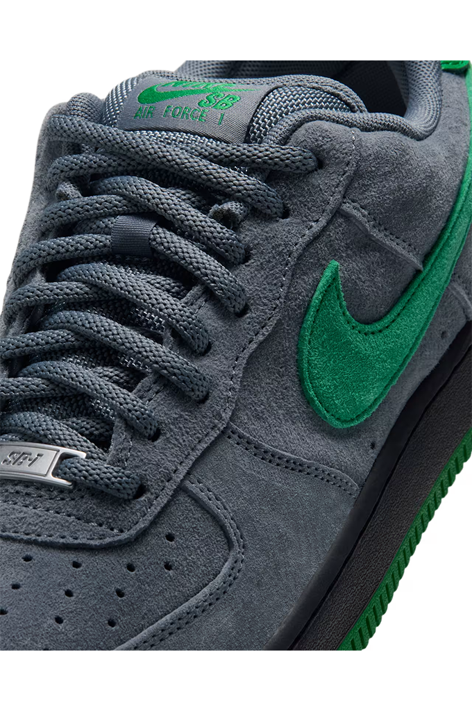 Nike SB Air Force 1 Low SE Cool Grey and Court Green sneaker close up showing grey suede upper and green Swoosh