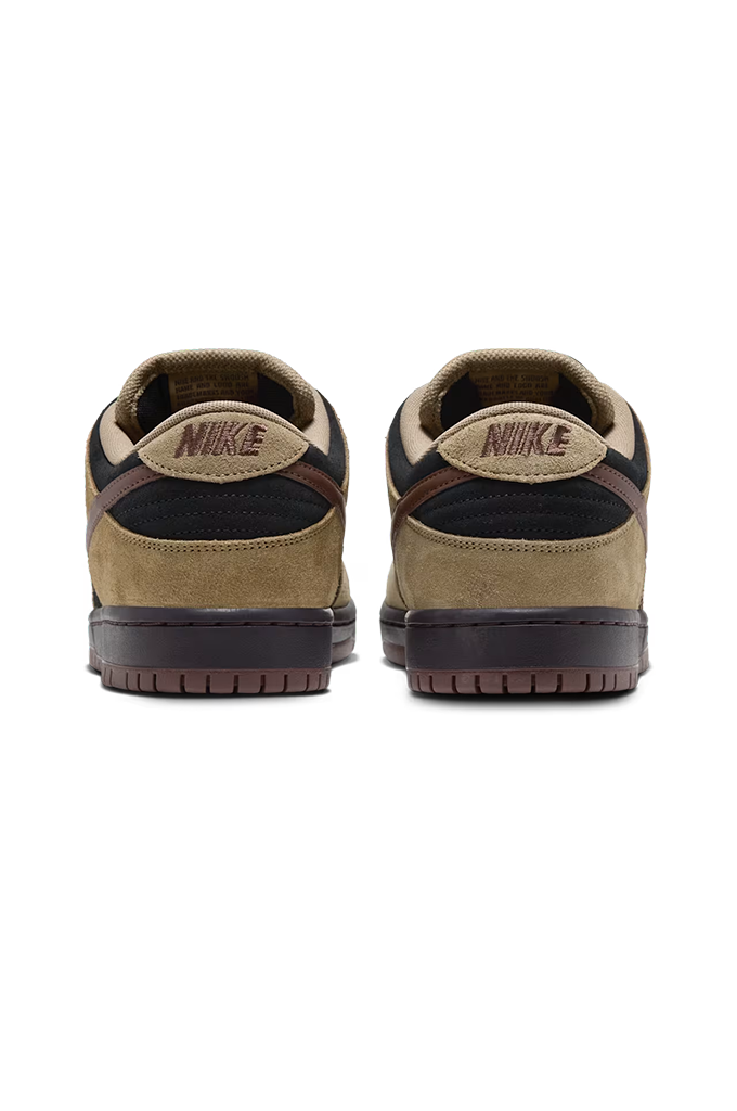 Rear view of a Nike Dunk sneaker in a colorway of tan suede, black leather, and dark brown. The shoe features a tan suede upper, black leather overlays, dark brown laces, a dark brown Swoosh, and a dark brown gum sole, shown from a side profile view on a white background.