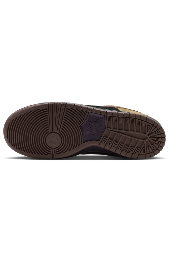 Sole of a Nike Dunk sneaker in a colorway of tan suede, black leather, and dark brown. The shoe features a tan suede upper, black leather overlays, dark brown laces, a dark brown Swoosh, and a dark brown gum sole, shown from a side profile view on a white background.
