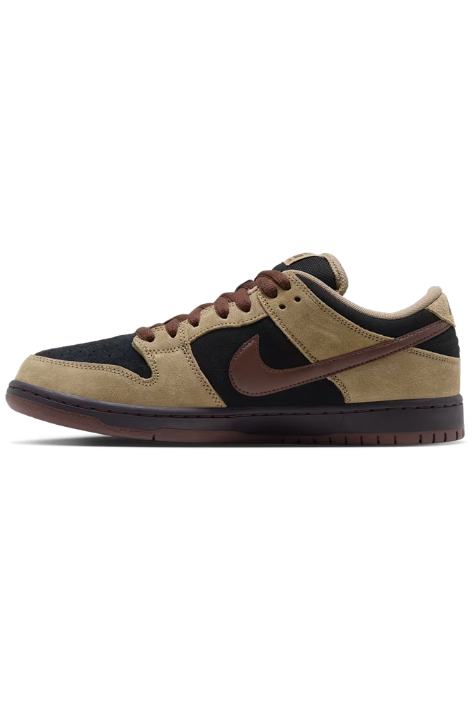 A Nike Dunk sneaker in a colorway of tan suede, black leather, and dark brown. The shoe features a tan suede upper, black leather overlays, dark brown laces, a dark brown Swoosh, and a dark brown gum sole, shown from a side profile view on a white background.