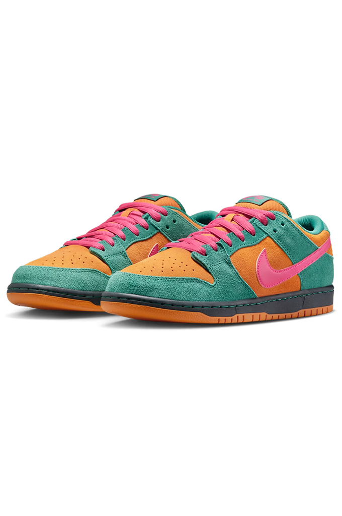 A pair of Nike Dunk Low sneakers in a vibrant multicolor colorway featuring teal green suede, bright orange overlays, hot pink laces and Swoosh, with a gum outsole, shown against a plain white background.