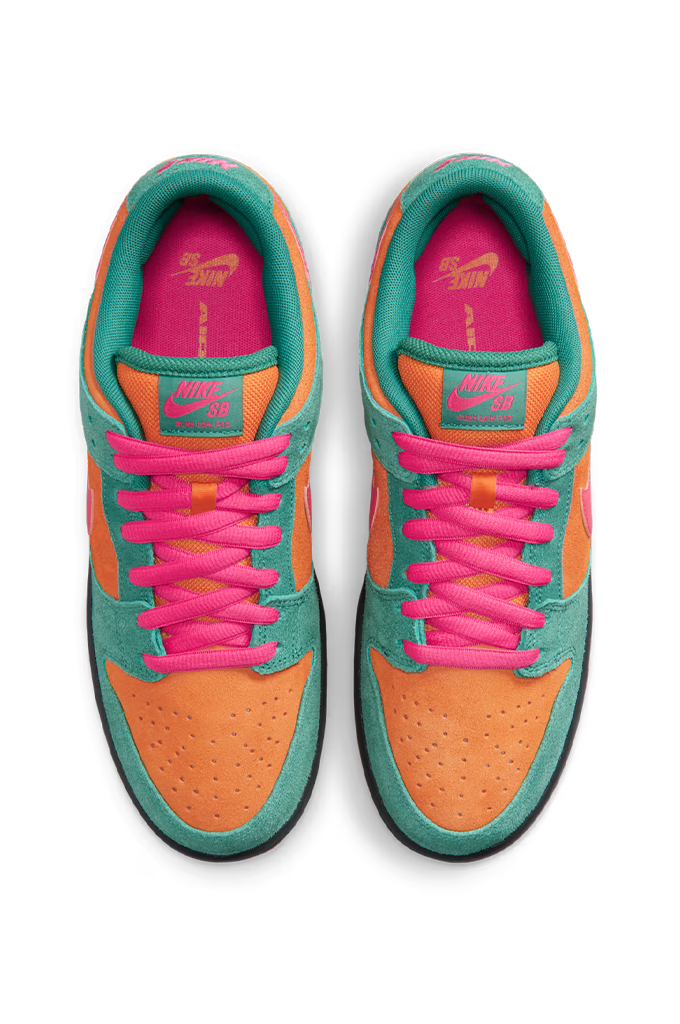 A pair of Nike Dunk sneakers shown from a top-down view, featuring a vibrant color-blocked design with neon orange suede overlays, teal green suede panels, bright pink laces and lining, and a black outsole.