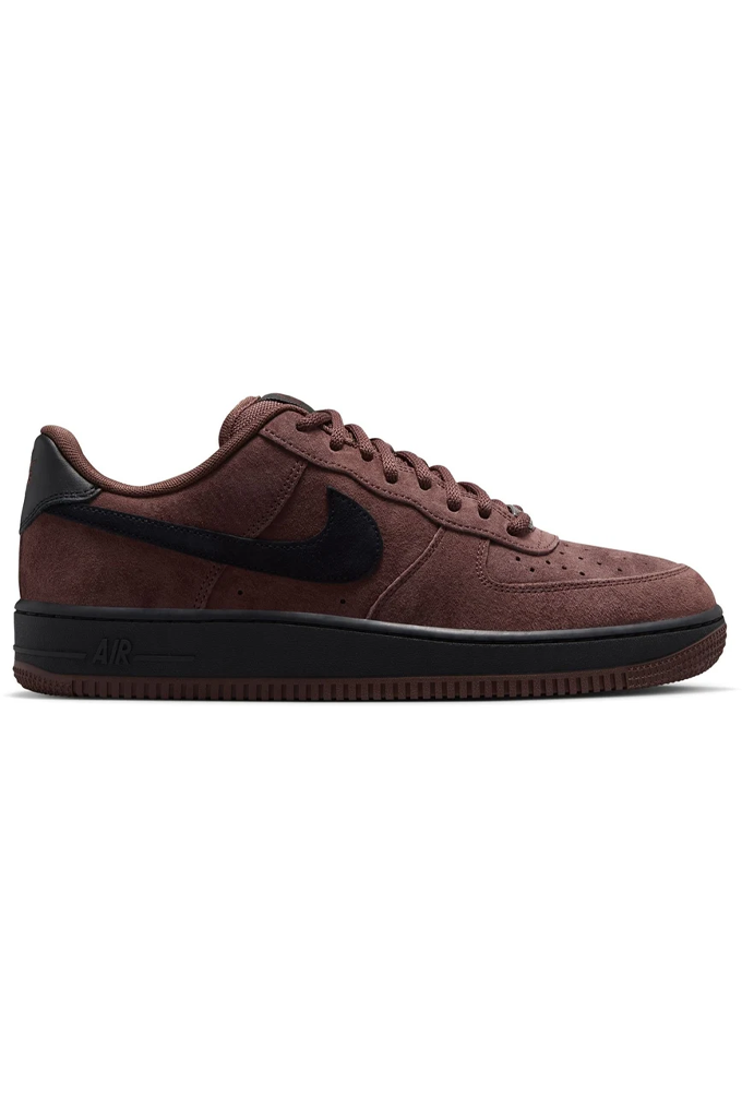 Maroon sneaker with white stripes on a white background