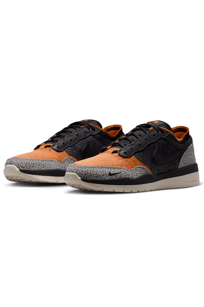 A pair of Nike Dunk Low sneakers in orange, black, and gray, displayed on a clean white background.#color_cobblestone-black-monarch