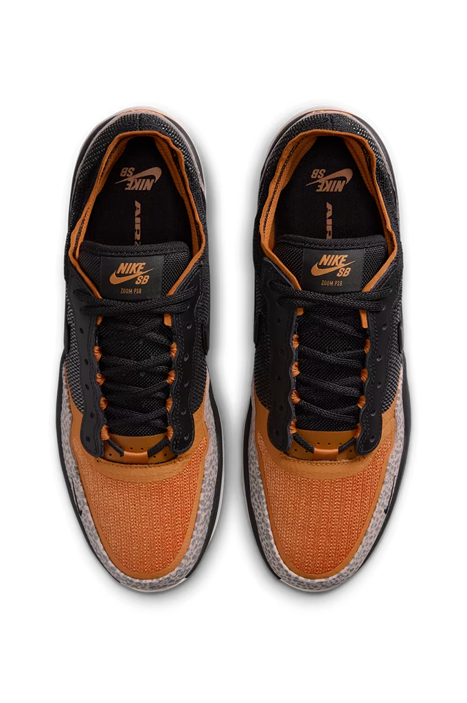 A pair of Nike SB  sneakers shown from a top-down view. The shoes feature a black and orange colorway with a textured knit upper, black laces, and a gray and black speckled outsole.#color_cobblestone-black-monarch