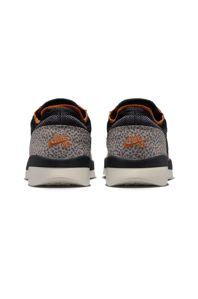 A pair of Nike Air Max 2013 sneakers shown from the back, featuring a gray and black leopard print heel counter, black mesh upper, orange Nike Swoosh, and orange lining, with a white and gray midsole.#color_cobblestone-black-monarch