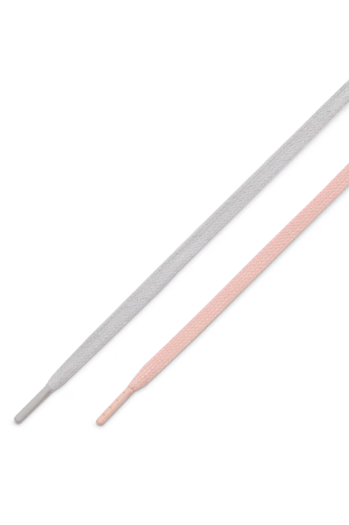 Two flat shoelaces, one light gray and one light pink, shown diagonally on a plain white background.