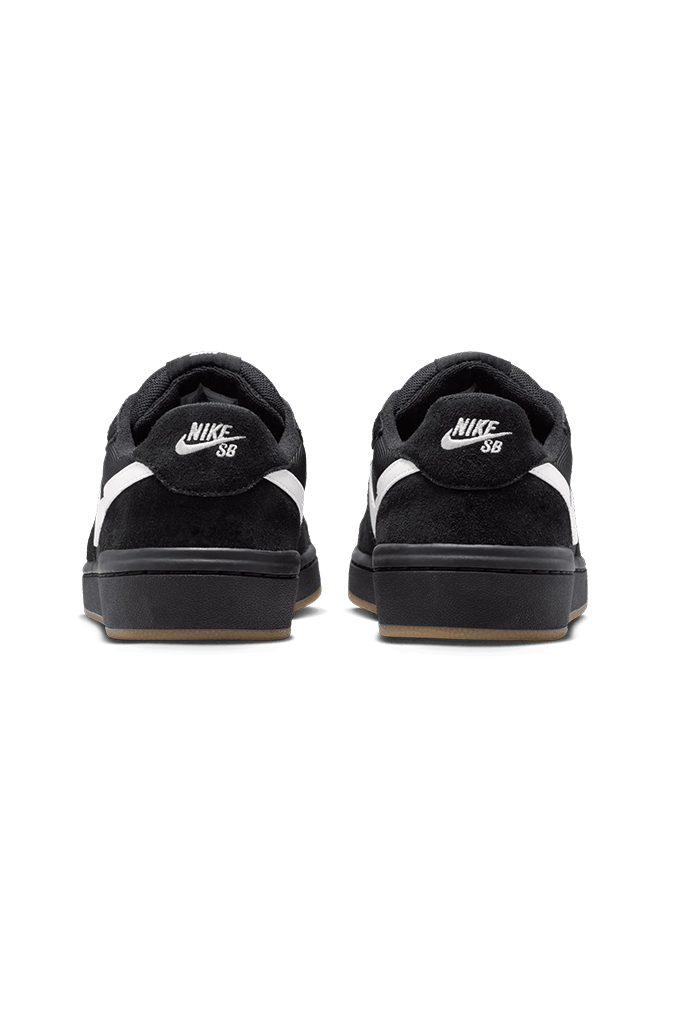 A pair of black Nike SB sneakers shown from the back, featuring white Nike branding and a gum sole, set against a plain white background.