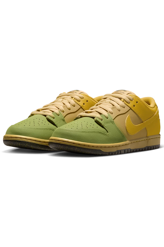 A pair of Nike Dunk Low sneakers in olive green and mustard yellow, featuring a gum sole and a yellow Swoosh on a white background.
