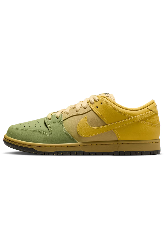 A Nike Dunk sneaker in a yellow and light green colorway, featuring a yellow leather upper, green suede overlays, and a tan midsole on a white background.