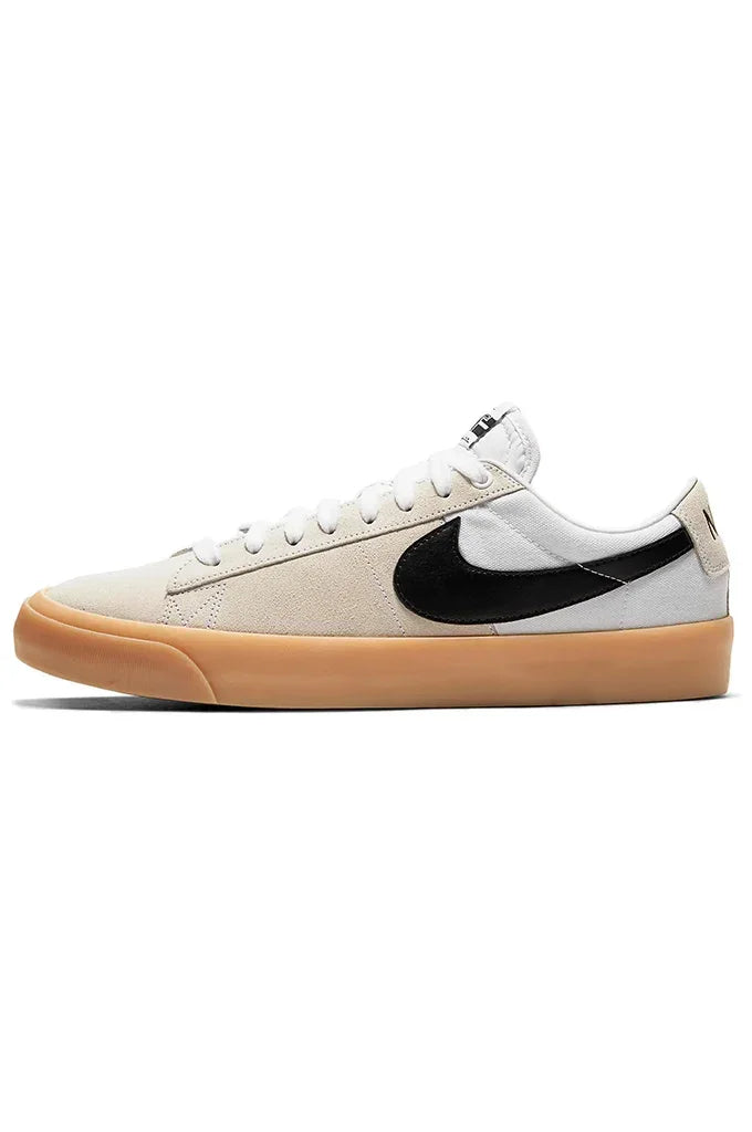 Beige and white skate shoe with black swoosh and gum sole, ideal for skateboarding and casual wear.#color_white-black