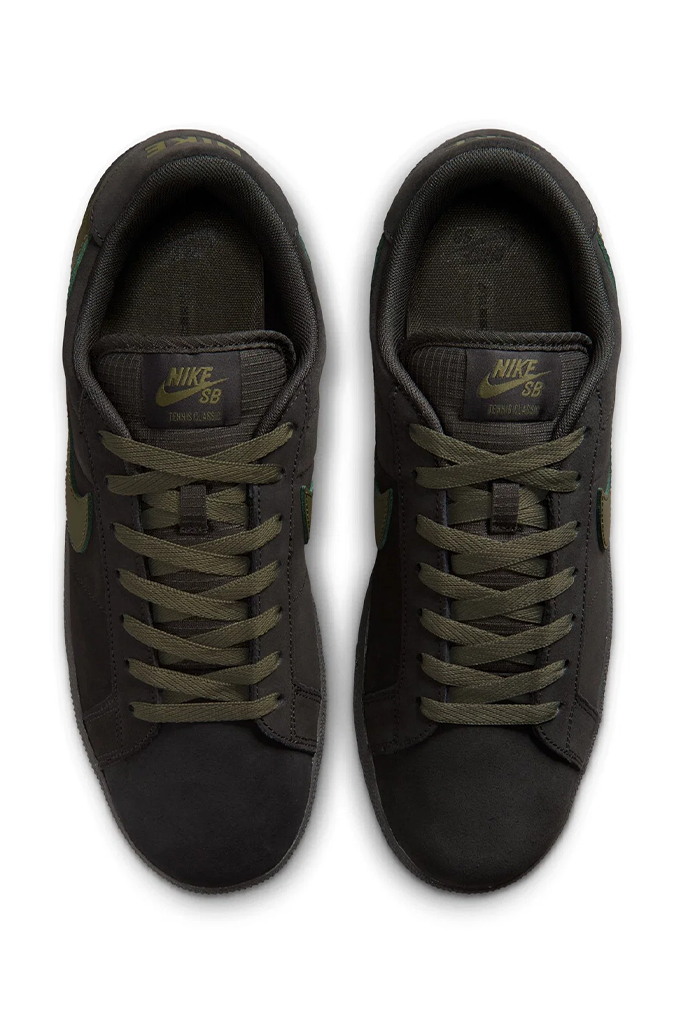 A pair of Nike SB sneakers in dark olive green and grey, viewed from a top-down angle on a white background.