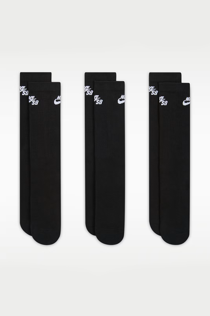 Three pairs of black crew socks arranged in three groups of two on a light gray background. Each pair features a white printed Nike logo and 'NIKE SB' text near the top.#color_black