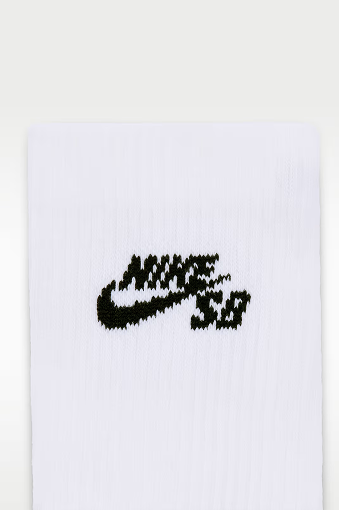 White knit sock featuring a black textured Nike SB logo on the front.#color_white