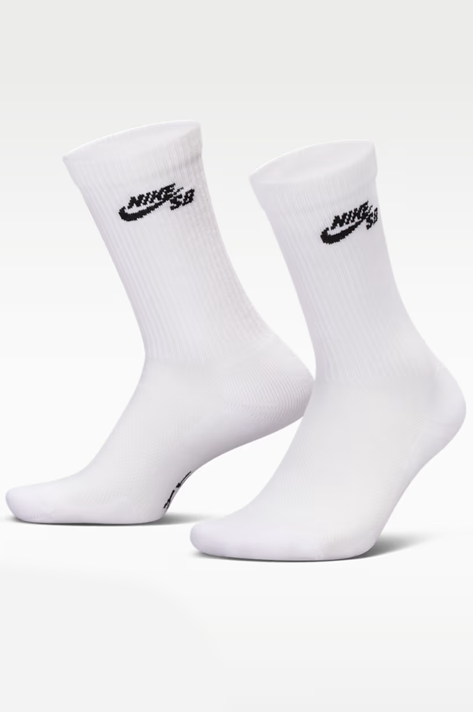 A pair of white crew socks with black Nike SB logos on the upper cuff, displayed against a clean white background.#color_white
