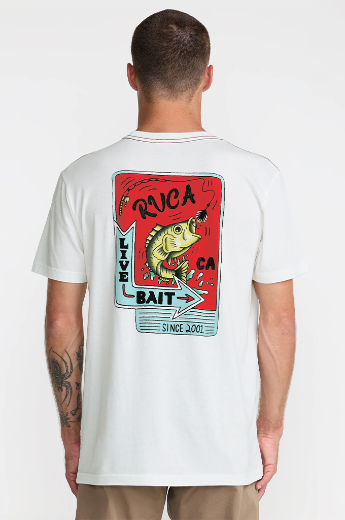 A man viewed from the back wearing a white t-shirt with a large graphic print on the back. The graphic features a red card design with a yellow bass fish, the text 'RVCA CA', 'LIVE BAIT', and 'SINCE 2001'.#color_antique-white