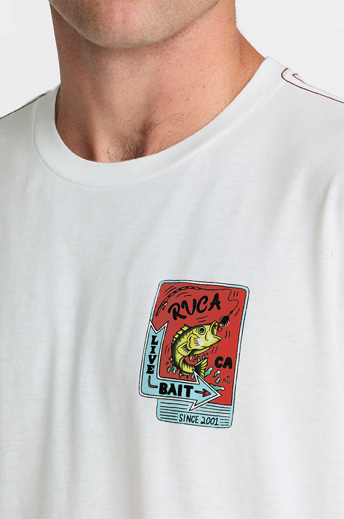A close-up of a person wearing a white crewneck t-shirt with a colorful graphic on the chest. The graphic features a red background with a cartoon fish, the text 'RUGCA', 'LIVE', 'BAIT', and 'CA SINCE 2001'.#color_antique-white
