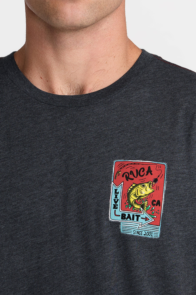 A close-up of a man wearing a dark heather gray t-shirt with a colorful graphic on the left chest. The graphic features a red background with a yellow bass fish, the word 'OUCOA' in black, and 'KILL BAIT' in white text.#color_black