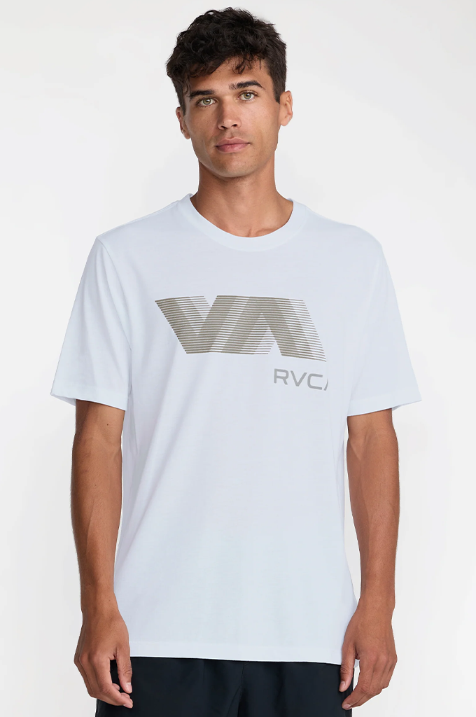 A man wearing a white short-sleeve t-shirt with a large gray and white striped 'VA' logo and 'RVC1' text on the front, photographed against a light gray studio background.#color_white