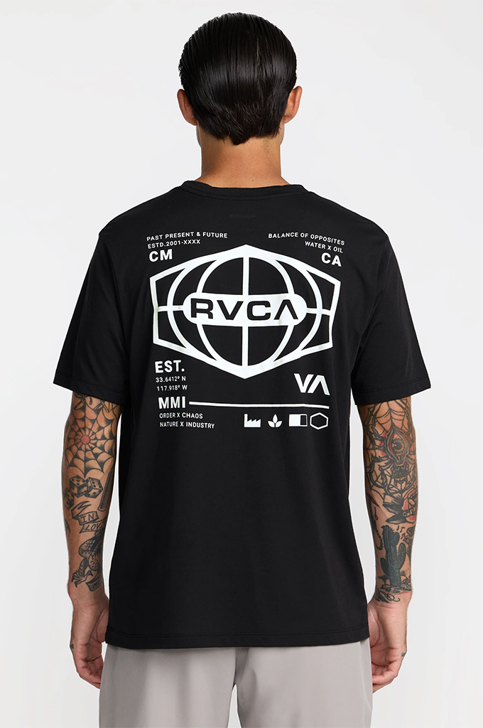 A man viewed from the back wearing a black short-sleeve t-shirt with a large white graphic print on the back. The graphic features the brand name 'RVCA' inside a geometric globe design, surrounded by smaller white text and logos.
