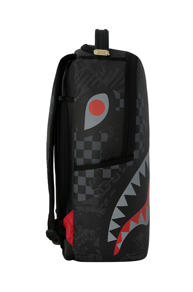 A black backpack featuring a shark-mouth graphic with red, gray, and white details, set against a plain white background.