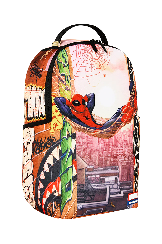 A backpack featuring a highly detailed, colorful graffiti-style collage print with Spider-Man, a cityscape, and street art elements, shown against a plain white background.