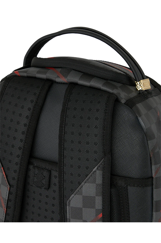 Close-up of a black backpack showing the padded shoulder straps, mesh ventilation panels, and a side pocket with a gray and black checkered pattern and subtle red accent lines.