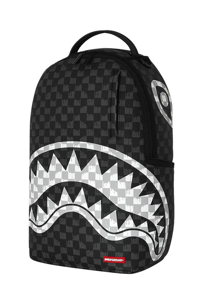 A black and gray checkered Shark Mouth backpack with a large white and gray shark mouth graphic on the front, featuring a top carry handle and a small red Sprayground logo patch.