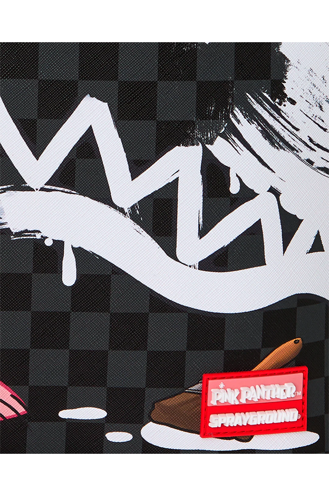 A close-up of a black and white checkerboard patterned surface with bold white graffiti-style lettering, a small brown object, and a red rectangular tag reading 'Pink Panther Spayground'.