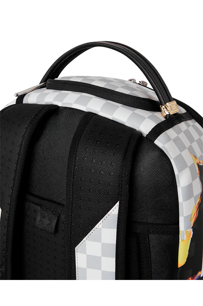 Close-up of a backpack showing the top handle, black padded shoulder straps, a black-and-white checkerboard pattern, and a small multicolor graphic on a white background.