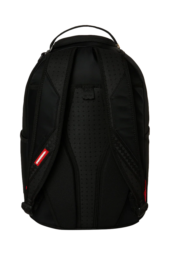 Black backpack shown from the back, featuring a perforated padded back panel, top carry handle, and small red brand tab on the side, photographed on a plain white background.