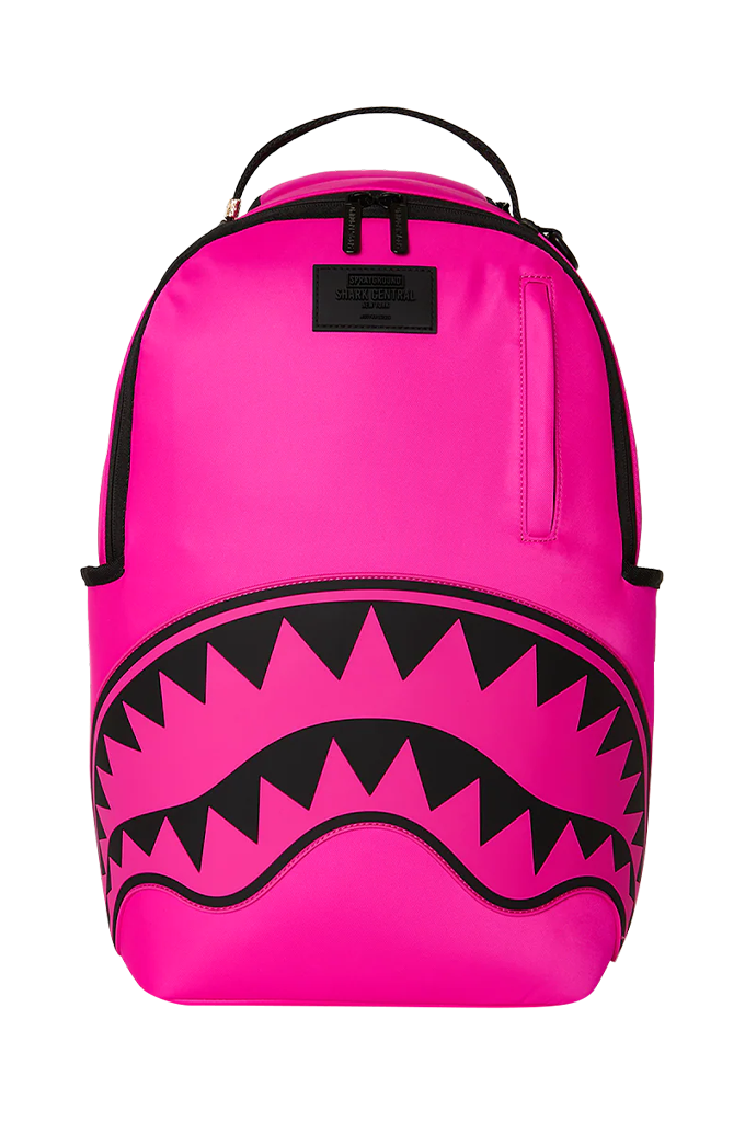 Bright pink backpack with a black shark-mouth graphic and black top handle, shown on a plain white background.