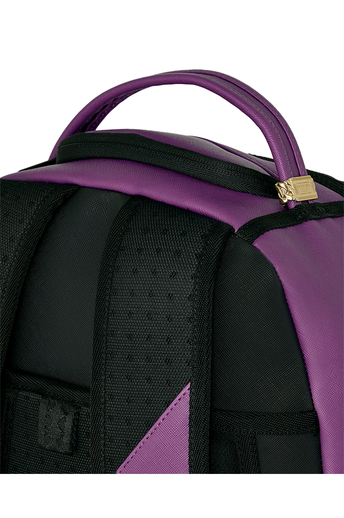 Close-up of a backpack showing the top handle, black padded shoulder straps, and purple side panels and trim against a white background.
