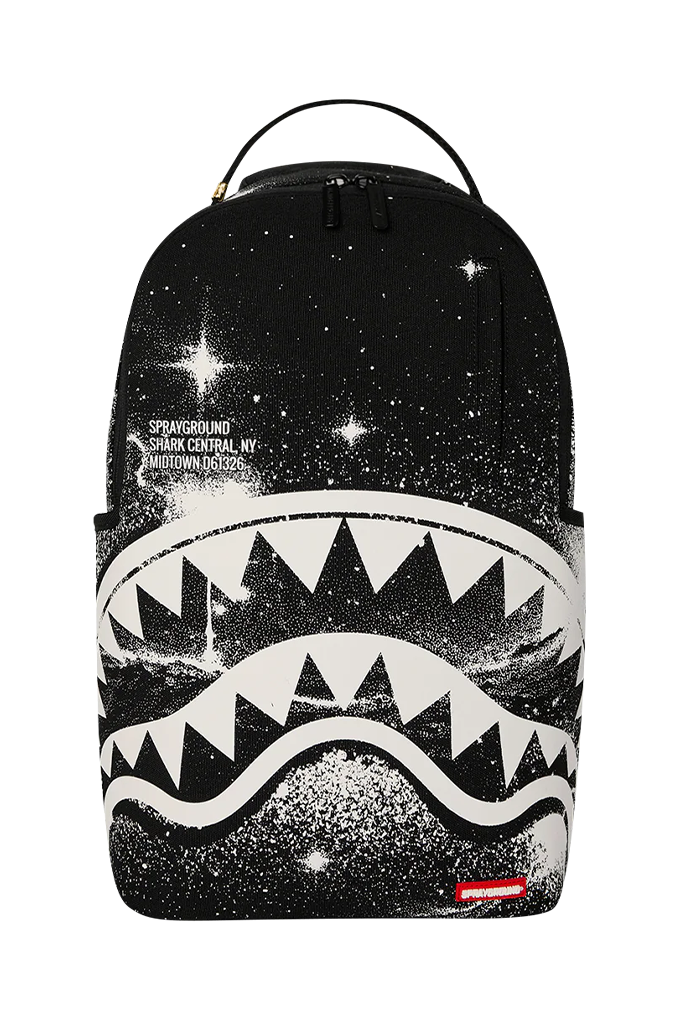 A black backpack featuring a white shark mouth graphic with stars and a galaxy print, shown against a plain white background.