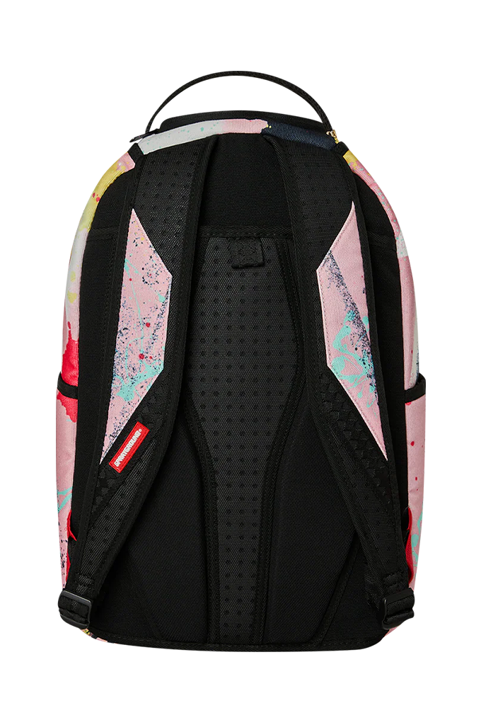 The back view of a backpack with a black perforated central back panel and black straps, featuring pink, yellow, and blue watercolor splatter patterns on the sides, on a white background.